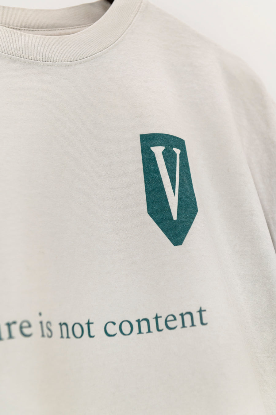 Arrival “Culture Is Not Content” Tee — Faded Bone
